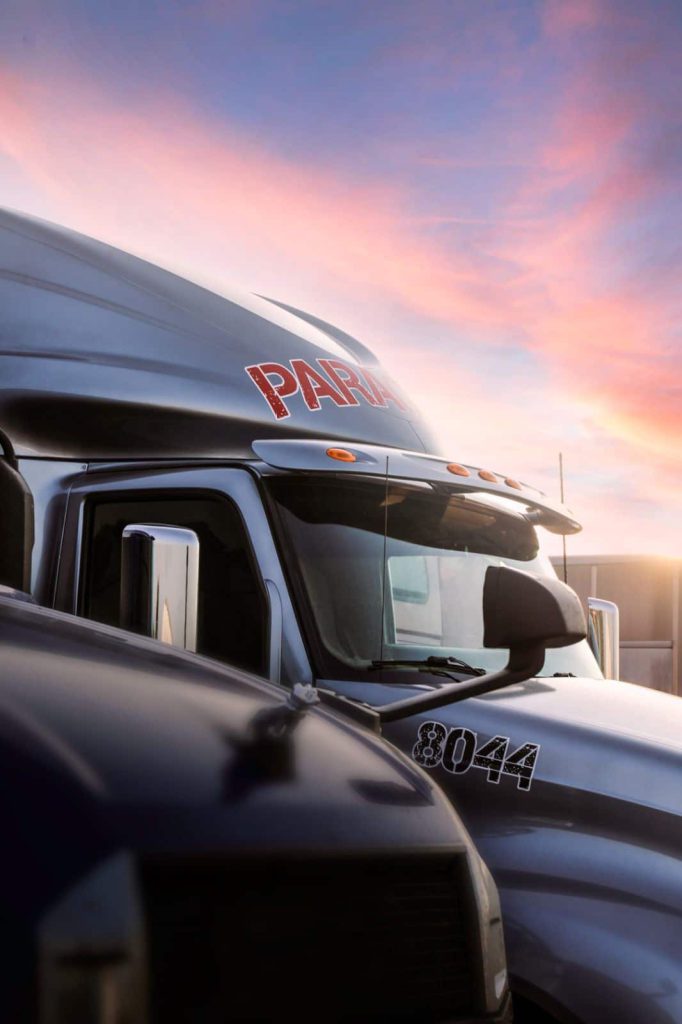 Paragon Freight Inc company truck — white dry van semi truck with Paragon Freight branding
