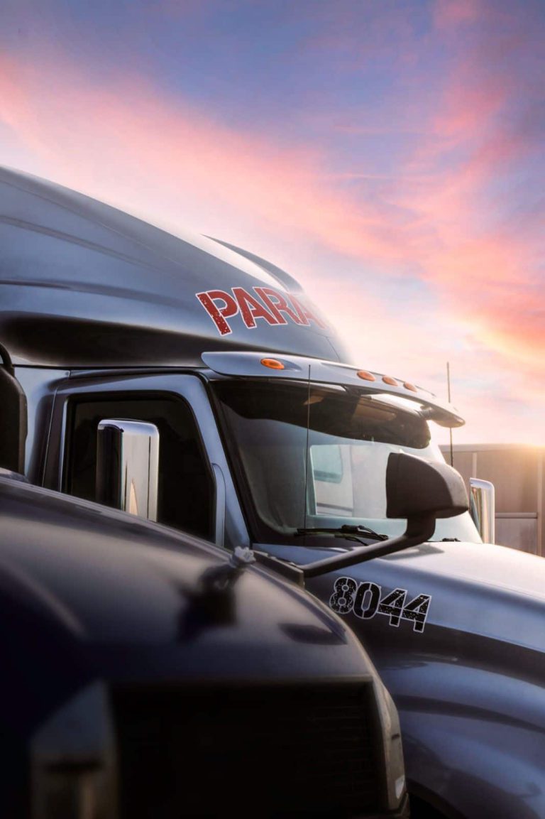 Paragon Freight Inc company truck — white dry van semi truck with Paragon Freight branding