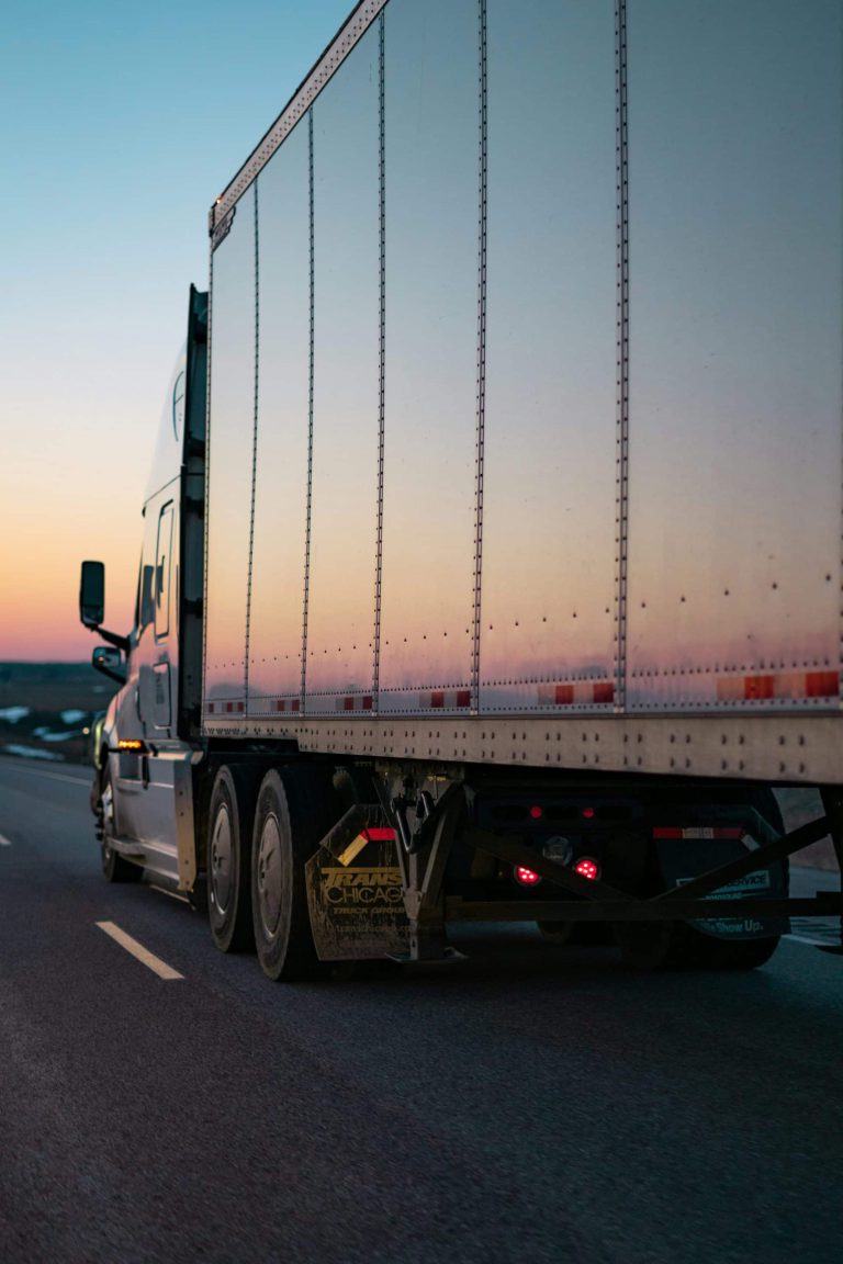 Dry van trailer on the highway at sunset — OTR trucking job