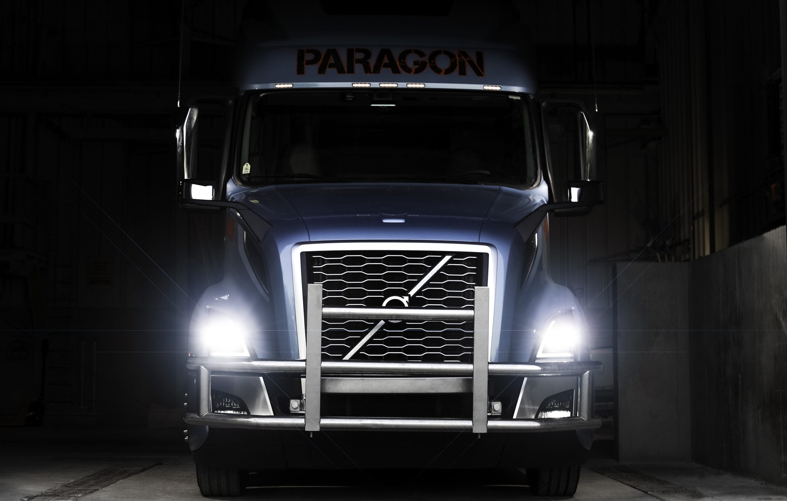 Truck parked at a rest stop during sunset — OTR trucker lifestyle and routine